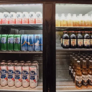 a refrigerator full of sodas and soft drinks