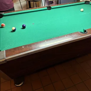 a pool table in a restaurant