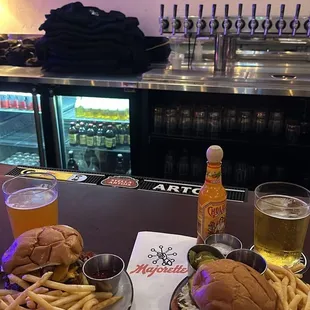 Smash burgers and fries at the bar