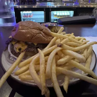 a plate of french fries and a burger