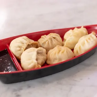 Si Si&apos;s handmade dumplings are an authentic taste of the Henan Provence of China where she was born and raised. Beef/Pork, Shrimp or chicken