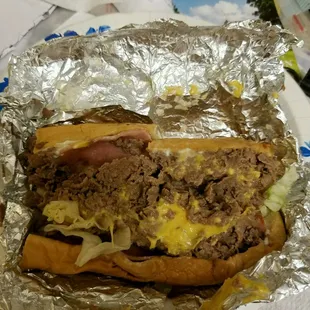 a hamburger wrapped in foil