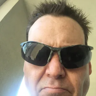 a man wearing sunglasses and a black shirt