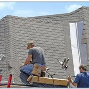 two men working on a roof