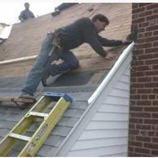 a man working on a roof