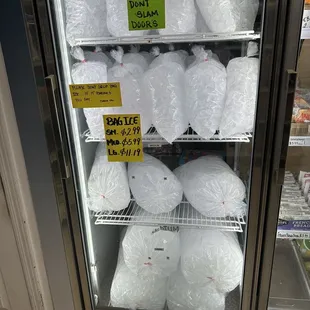 a refrigerator full of plastic bags