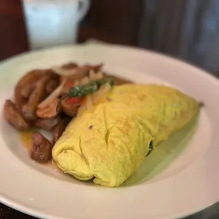 Pork omelet  Lots of kalua pork and spinach inside.