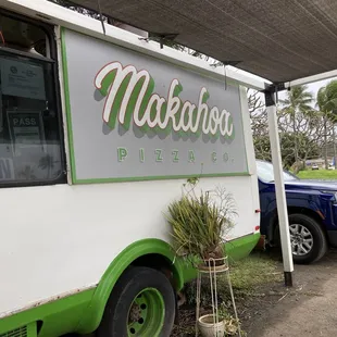 The sign at the front of the food truck.