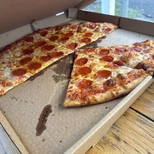 Large pepperoni pizza some slices missing it was too good to wait and eat.