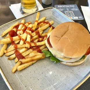 Burger, fries, and beer at the bar.