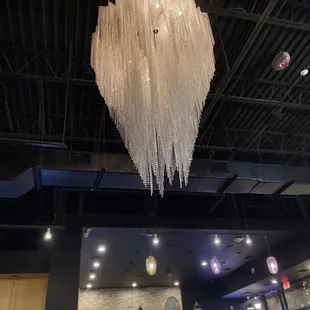 Crystal chandelier in middle of dining room