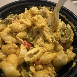 I made my own Mac! I ordered shells, spicy yellow cheese and I added pesto, tomatoes, jalapeños and chicken.
