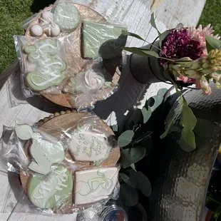 a table with cookies and flowers