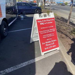 a sign in a parking lot