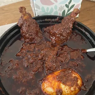 Oil slick. Tiny piece of dry burnt chicken