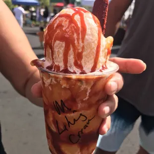 A mangonada with a tamarind stick