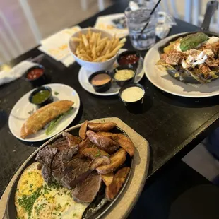 Steak and eggs  Short Crispy Fries Short ribs Empanada