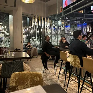 people sitting at a bar