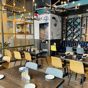 a dining area with tables and chairs
