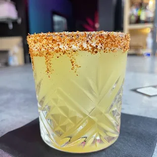 a shot of a margarita with a sprinkle of salt on the rim