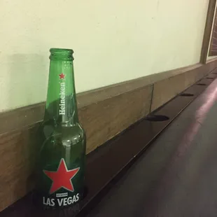 Cup/beer holders behind the benches in the bowling alley!