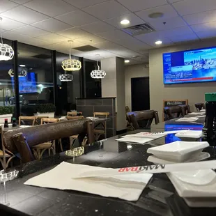 Seating area by the window and sushi bar