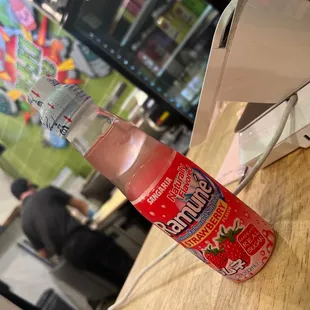 a bottle of water on a table