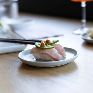 Yellowtail Nigiri: Jalapeno, Yuzu, Sriracha