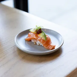 Salmon Nigiri: Avocado, Crunchy Garlic, Sriracha, House Ponzu (Must try)