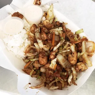 Chicken hibachi with jasmine rice cabbage carrots and onions