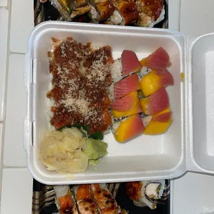 Fire cracker roll, green dragon roll, baked salmon roll, mango roll
