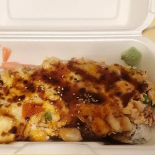 a close up of a meal in a styrofoam container