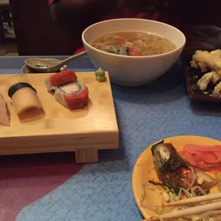 Udon and sides of kimchi, pickled cucumbers, bean sprouts and spicy broccoli
