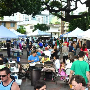 Circled by a variety of venders, patrons enjoy dinner and shopping with new and old friends.