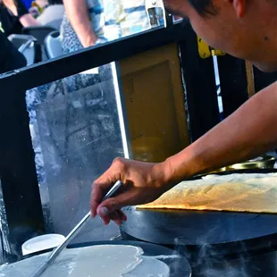 One of the venders prepares his scrumptious crepe.