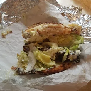 a sandwich with lettuce and cheese