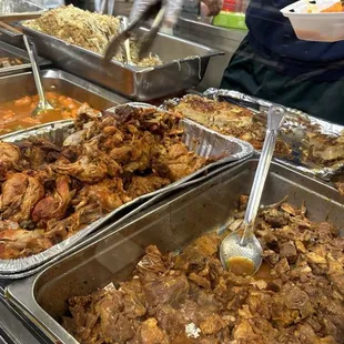 a man serving food at a buffet