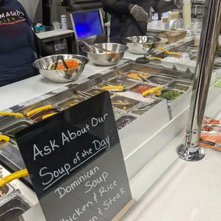 a woman ordering food at a counter