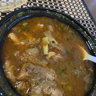 a bowl of soup with a spoon in it