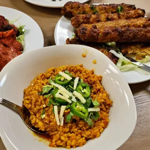 a bowl of rice and a plate of meat