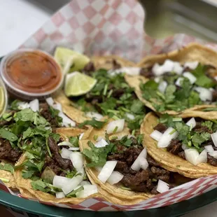 a plate of tacos and salsa