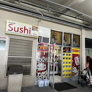 Small storefront in the mall under the overhang by the parking garage