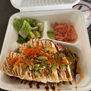a close up of a meal in a styrofoam container