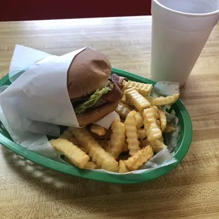 Bacon cheeseburger with fries and a drink