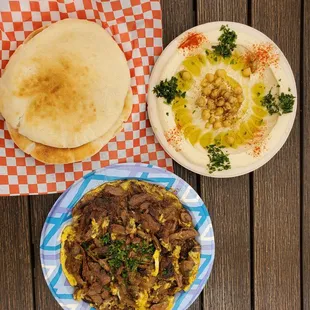 Beef and eggs, hummus, and pita bread