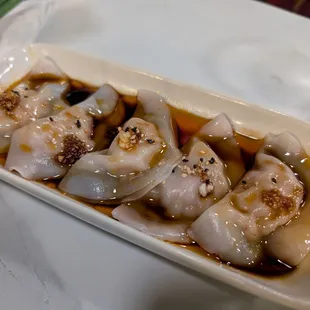 Pork dumplings in chili oil