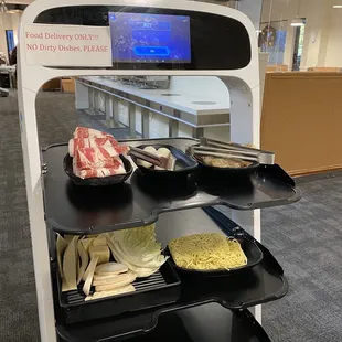 Robot food delivery! They still don't trust them to bring the hot soup though.. yet.