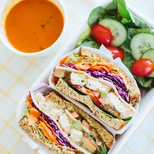 a sandwich with a side of salad