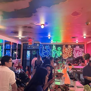 a group of people eating at a restaurant