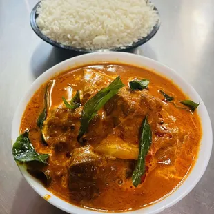 a bowl of curry and a bowl of rice